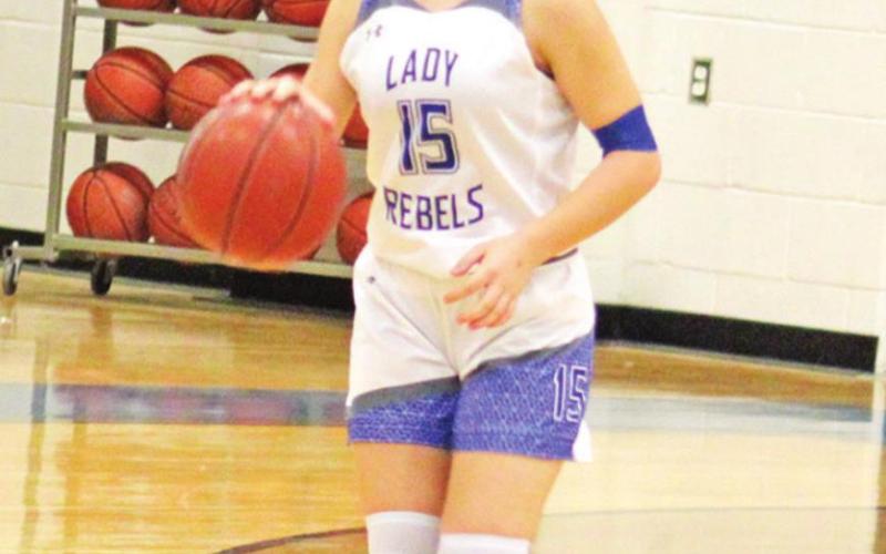 Lady Rebels defeat CHESS, fall in district opener and in Monday matinee