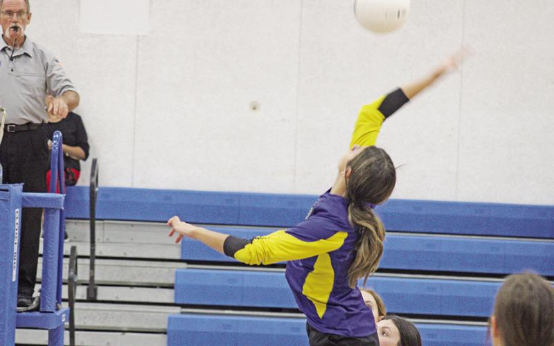 Harts Bluff’s Alexis Gonzalez jumps for a spike during Tuesday’s match at Sulphur Bluff. The Lady Bulldogs open district play Tuesday against Rivercrest. COURTESY PHOTO / DJ SPENCER