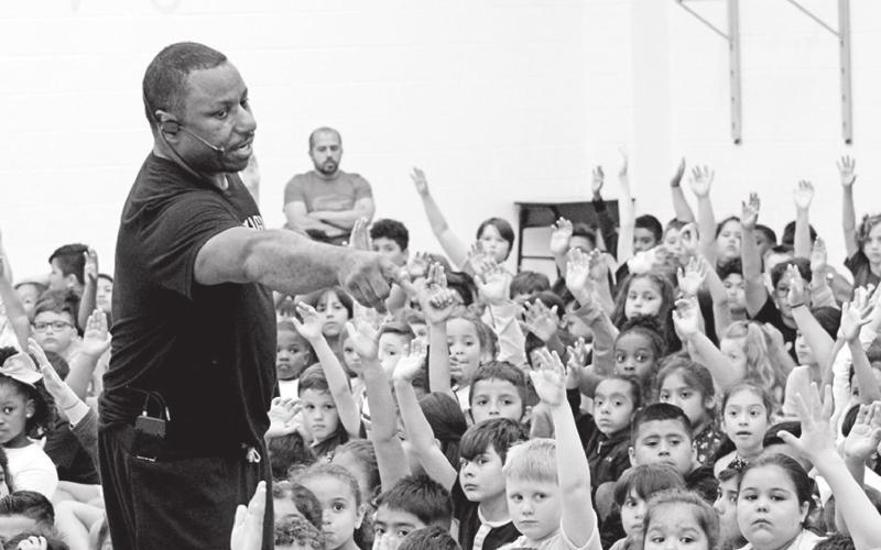 Mr. Magic Buffy Coleman selects participants for the “Magic Circle” from a crowd of enthusiastic students at E.C. Brice Tuesday afternoon.