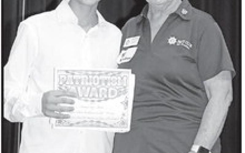 Sebastian Cates (left) receives his award from Pilot Club member, Susan Old COURTESY PHOTO