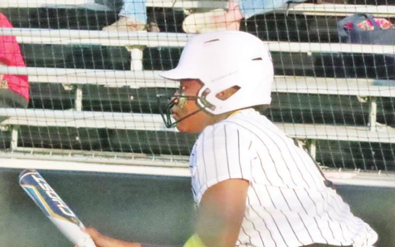 Amariya Miller drops down a bunt. PHOTOS BY JOHN WHITTEN