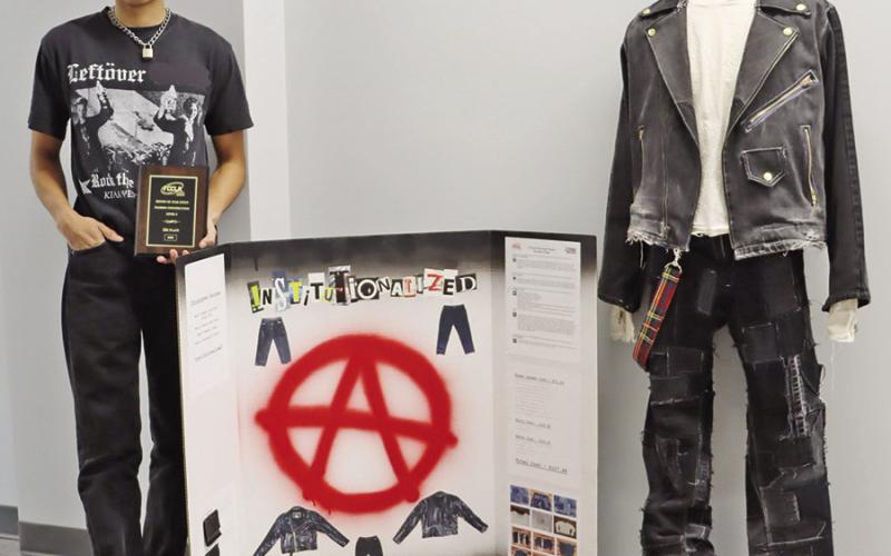 Christopher Escobar with his Fashion Construction project.