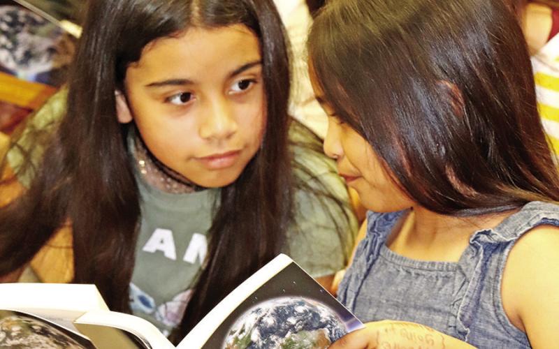 Brice 3rd graders Josie Rodriguez and Nicole Escobar share new knowledge they have found
