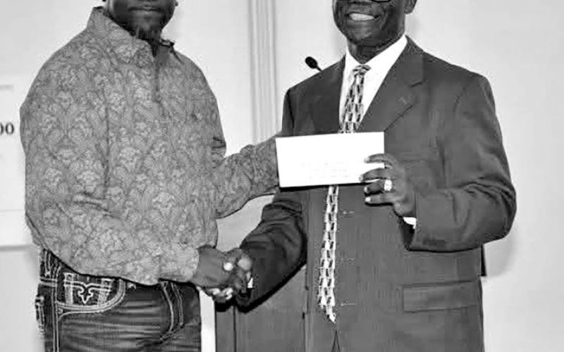 Sponsorship check presentation in the amount of $10,000. Billie Wells (Pilgrim’s Community Liaison) and Jerry Dell Walker (The Whaylan Payne Memorial Scholarship Coordinator)