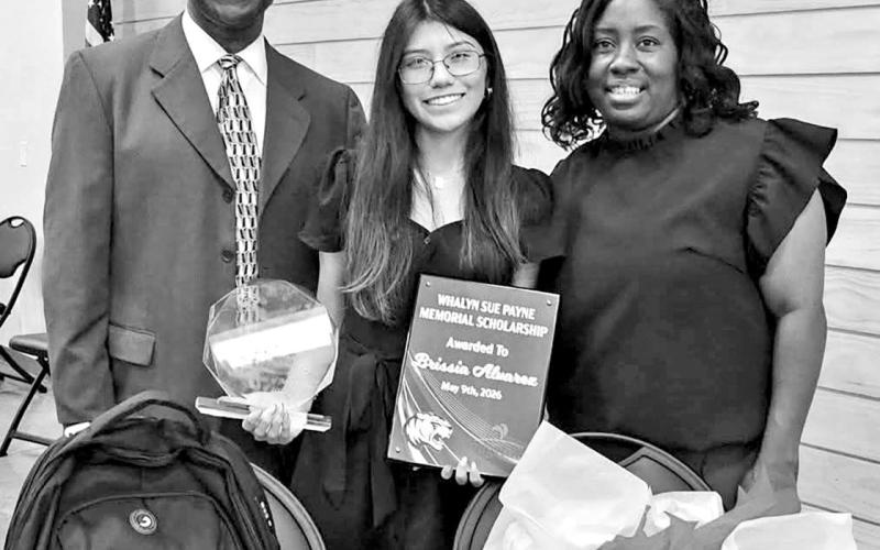 MPHS 2026 Valedictorian Brissia Alvarez pictured with The Whalyn Payne Memorial Scholarship Coordinator Jerry Dell Walker and MPHS Government and Economics Dual Credit Teacher Crystal Jackson-James