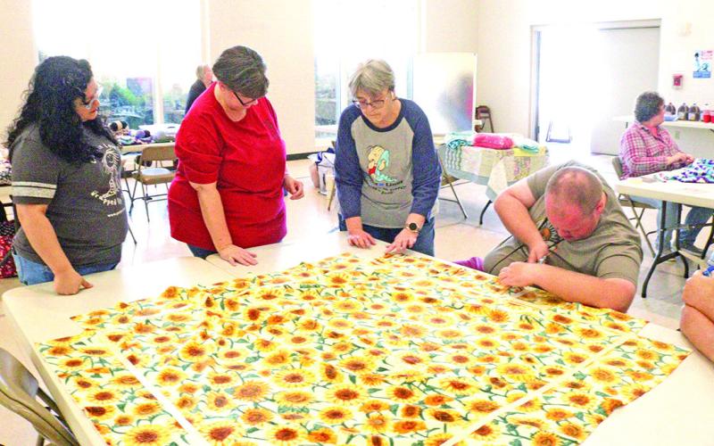Volunteers work together for National Make a Blanket Day