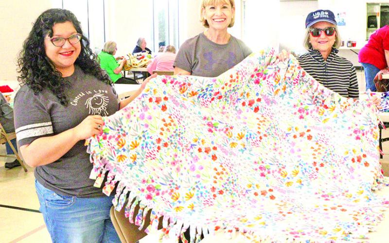 Volunteers work together for National Make a Blanket Day