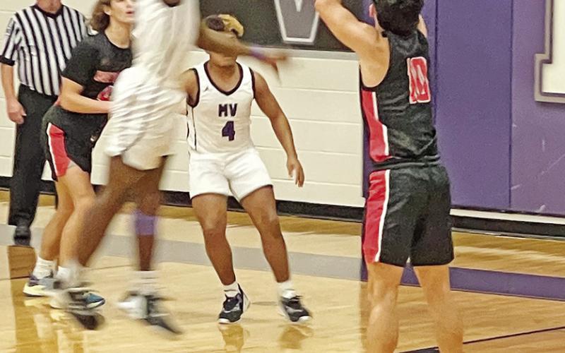 Adrian Ramirez fires a three-pointer. The eighth-ranked Red Devils defeated Mount Vernon, 50-29, and took on Winnsboro Tuesday. Both Chapel Hill squads will play at Mineola Friday. COURTESY PHOTOS