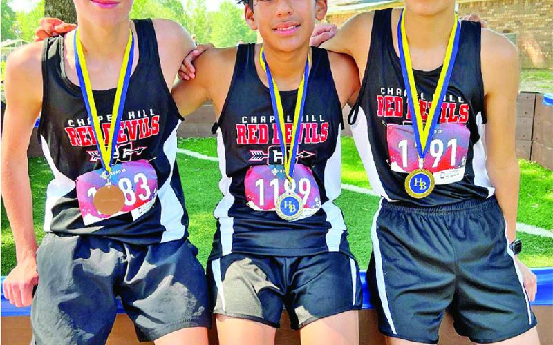 COURTESY PHOTO Chapel Hill Junior High Boys placed 1st for the second week in a row. Top finishers included, from left to right 6th place Sloan Abbott 12:44, 2nd place Andres Delgado 12:24, and 1st place Moises Netro 12:09.