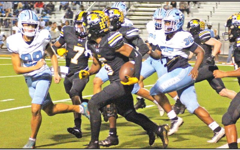 Mount Pleasant’s Makhi Grant returns a blocked extra point for two points during Friday’s game against Frisco Emerson. The Tigers fell to the state-ranked Mavericks, 62-16. TRIBUNE PHOTO / QUINTEN BOYD