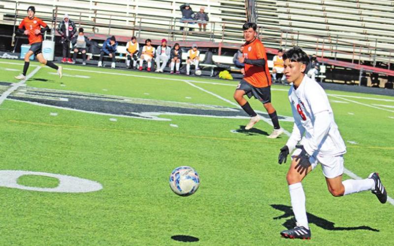 Miguel Bello chases down a loose ball during a recent Chapel Hill soccer game. TRIBUNE PHOTO / QUINTEN BOYD