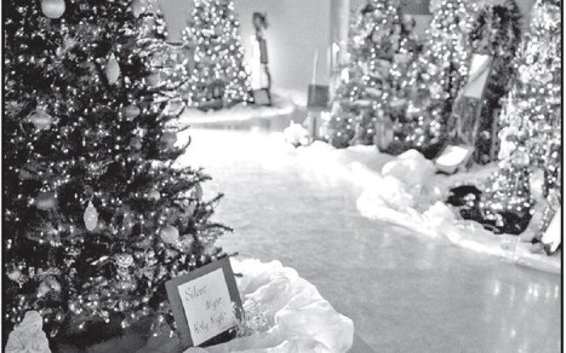 Trees at First Methodist Church depict Christmas Carols