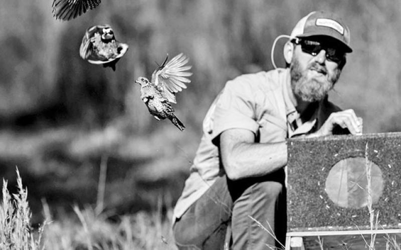 Garrett Gordy watches as wild-trapped northern bobwhite quail take flight on his family’s 9,000 acre ranch in Polk County earlier this year. Tall Timbers translocated 120 quail from Florida to the ranch as part of the Western Pineywoods Quail Program. COURTESY PHOTO / CARTER MORBY