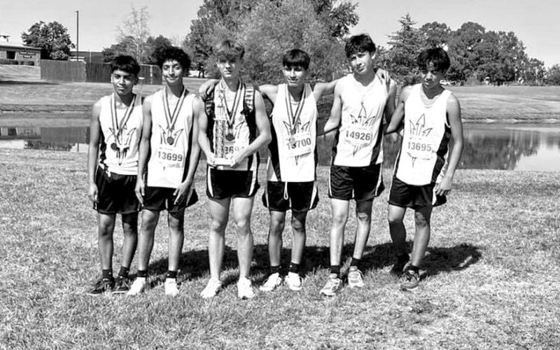 JV boys team with medals and plaque