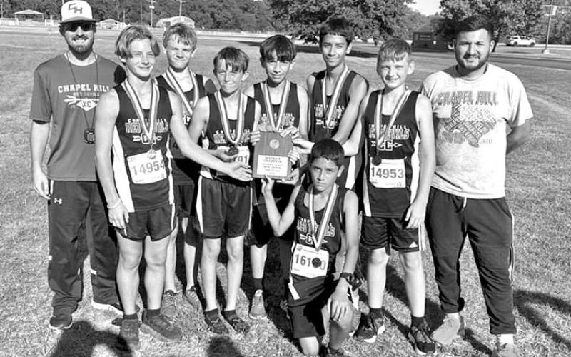 JH boys team with medals and plaque