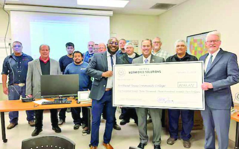 Pictured: Front row (from left) is Jimmy Smith, NTCC; Commissioner Alberto Treviño, III; Mechanic Clemente Zapata; and Dr. Ron Clinton, NTCC. Second row (from left) is: Newly Weds Foods Plant Manager George Winchester; Mechanics Andres Nava, Daniel Reames, Fernando Gonzalez; and PLC Instructor Mark Blair. Third row (from left) is Maintenance Manager Margarito Serna; Mechanics, Rudi Pastrana, Chris Pierce, Jitendra Mistry, and Jeremie Shuler. COURTESY PHOTO