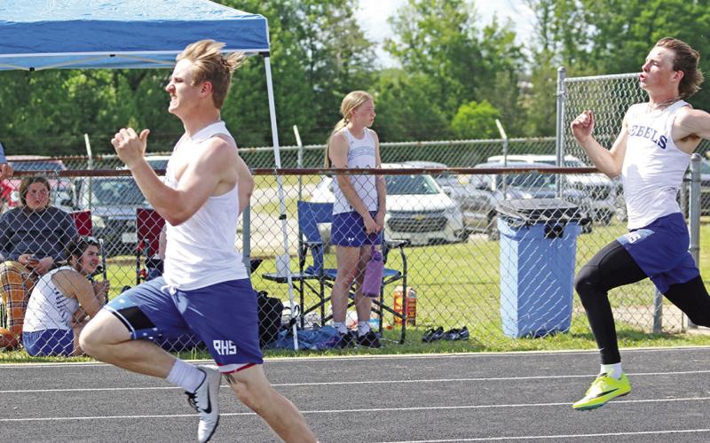 Rivercrest’s Zane Dees (front) and Mark Grider (back) finished first and second in the 100 meters during Wednesday’s area track meet, both punching their tickets to regionals. TRIBUNE PHOTO / QUINTEN BOYD