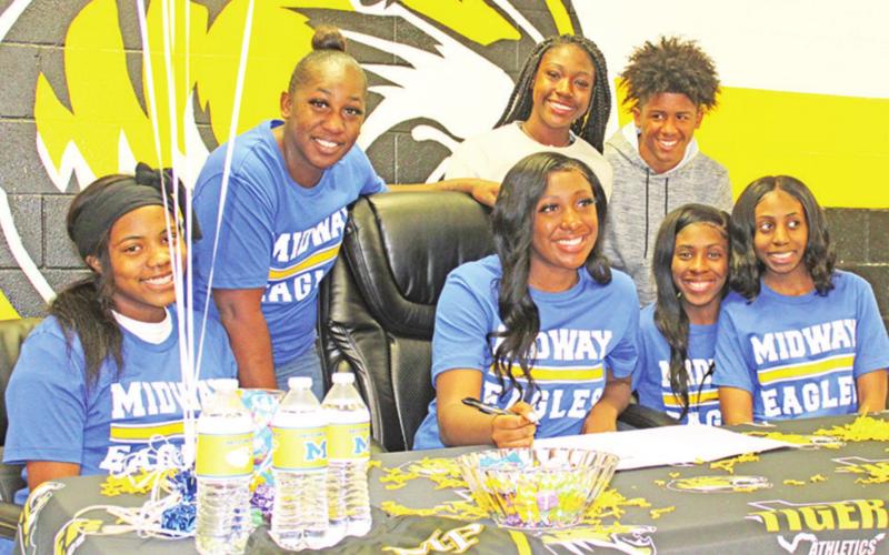 Mount Pleasant volleyball middle blocker Trinitee Brannon signed her letter of intent to play at Midway University in Midway, Ken. last week. TRIBUNE PHOTO / QUINTEN BOYD