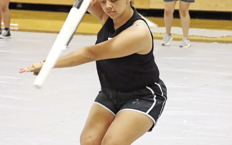 Jennifer Castro practices the rifle piece