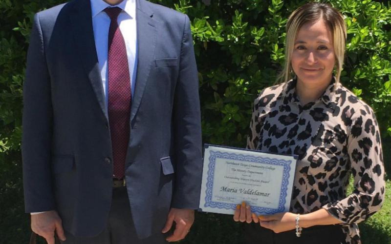 NTCC Professor John Russo with student Maria Valdelamar who was named Outstanding History Student this semester and Professor Russo’s ever-present and popular seeing-eye dog.