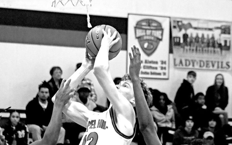 Basket For Bryce Chapel Hill’s Bryce Grissom (12) puts up a short jumper against visiting Daingerfield last week. The Red Devils, now 3-2 in District 13-3A and 14-4 overall, rebounded from the loss to the visiting Tigers to beat Hughes Springs on Friday night, 84-30.