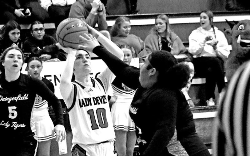 Jumper Between Defenders Chapel Hill’s Keira Hawkins (10) puts up a shot between two Daingerfield defenders last week.