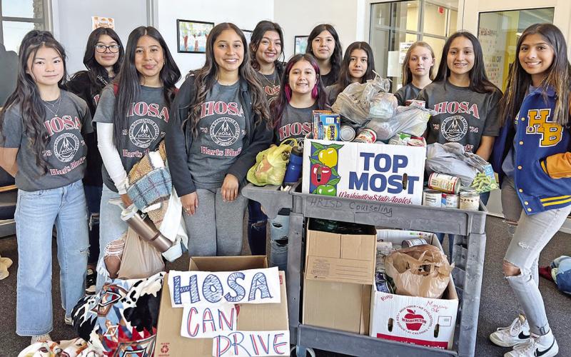Harts Bluff ISD HOSA recently teamed together to collect cans for Titus County Cares. COURTESY PHOTO
