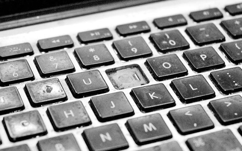 The factory keyboard is beaten and battered after years of use. It’s missing one key and has several others that work only when they want to. External keyboards have remedied the problem until now. (Photo by Matt Williams)