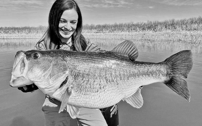 Lady angler Lea Anne Powell of Lake Jackson displays the 12- pound, 3-ounce bass she caught in February at Lake O.H. Ivie. Powell, who caught the fish on spinning rod, has submitted an application to the International Game Fish Association to have the fish certified as a 12-pound line class world record.