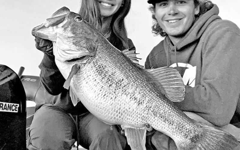Fishing guide Dalton Smith (right) also put Powell on a 10.58 pounder that slammed her crankbait. She cracked her personal best twice in two days. COURTESY PHOTOS / DALTON SMITH