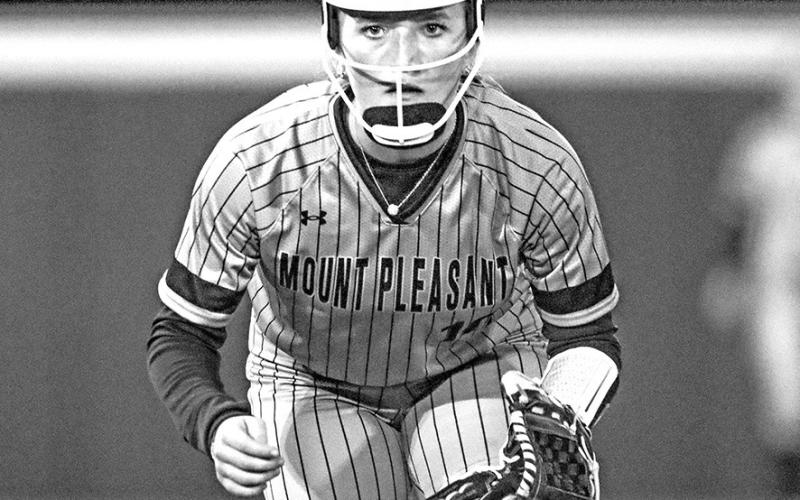 Tenley Marshall locks in on the batter during district action against the Whitehouse Ladycats, staying ready as the pitch comes home.