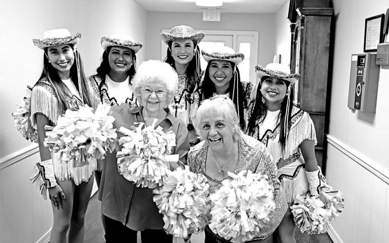 Resident,BarbaraRust,tellsTigerDollofficers(LtoR)AudreyFisher,VioletCastaneda,and ResidentsLindaBragg(left)andEmilyReed(right)enjoytimewiththeTigerDollofficers. Morgan Zepeda, about her granddaughter Jessie who was also a Tiger Doll.
