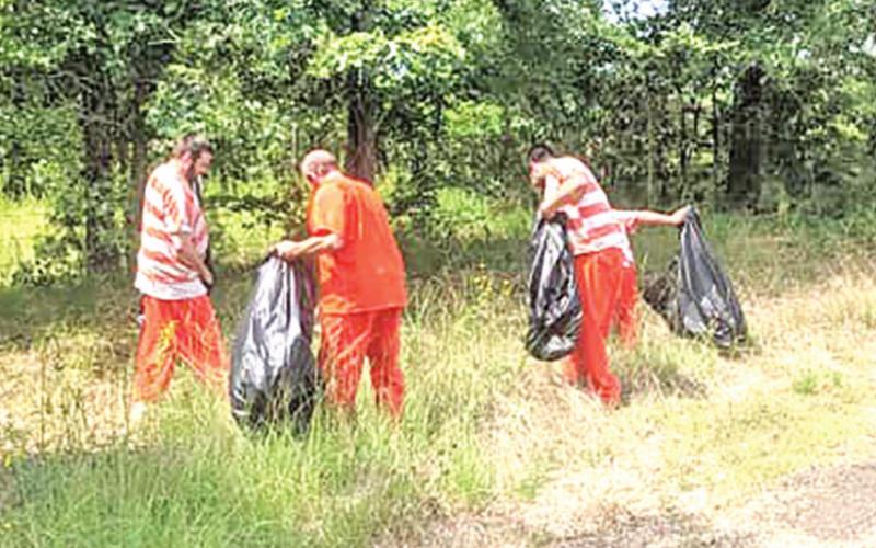Inmates clean up county