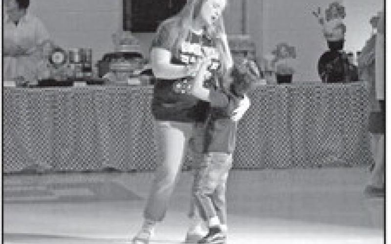 Elijah dances with his adoptive mom to a 50’s love song.