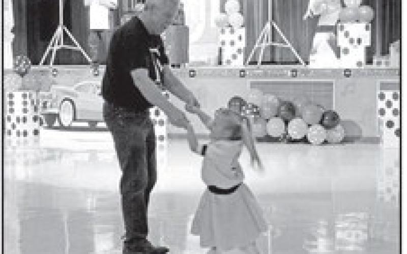 A Pink Lady dancing with her grandfather.