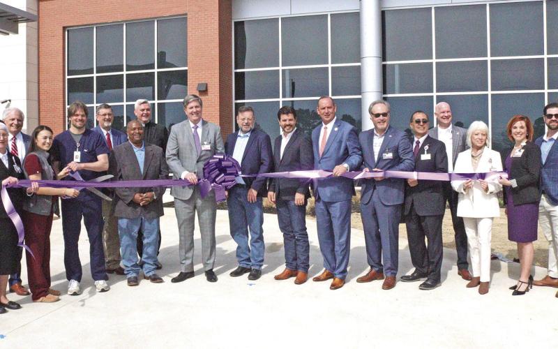 Dr. Brian Allgaier cuts the ribbon signifying the opening of CHRISTUS Health’s new emergency care center.