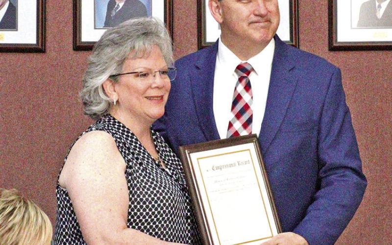 Congressman Moran presents congressional record to Susan Derrick.