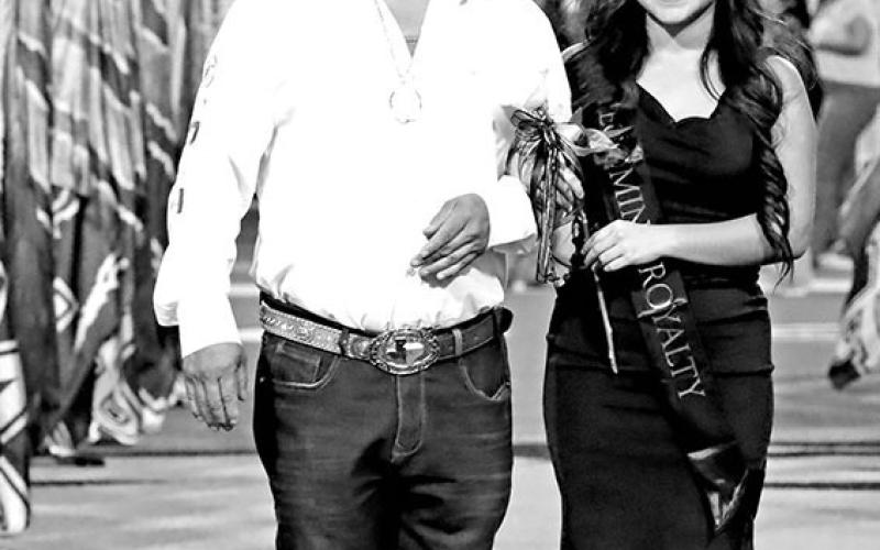 JV Football Sweetheart, Jacquelin Damian (right), escorted by her father, Pedro Damian