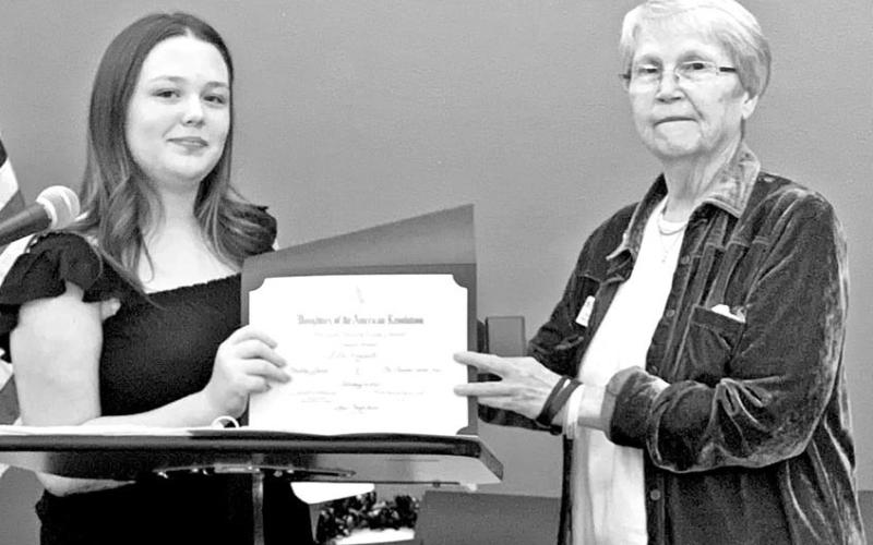Ella Rosewell (left) receives her certificate at the DAR awards banquet COURTESY PHOTO