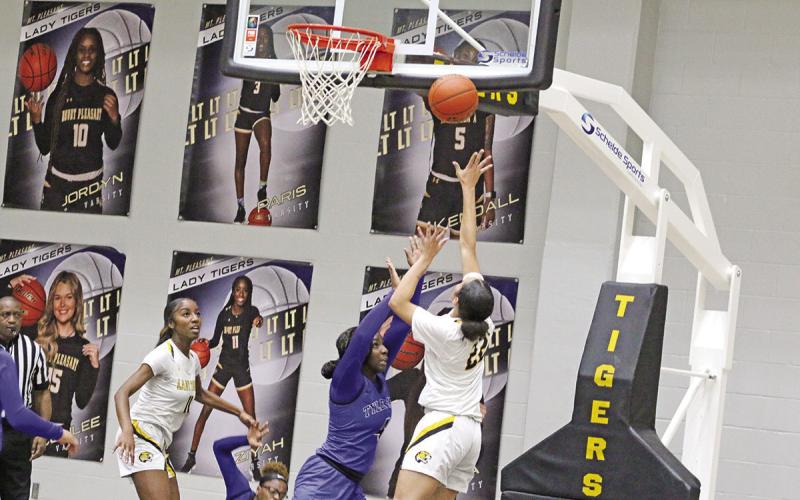 Mount Pleasant’s Morgan “Pinkie” Brooks puts up a layup during Friday’s game. The Lady Tigers remained undefeated with a 40-34 win at home over Tyler High. Mount Pleasant traveled to Whitehouse Tuesday and will host Hallsville Friday. TRIBUNE PHOTO / QUINTEN BOYD