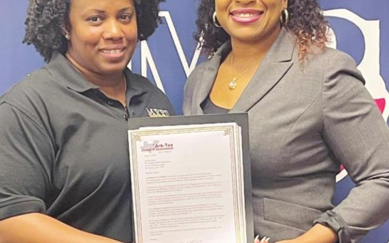 Amber James is honored by Rea Allen during National Public Safety Telecommunications Week. COURTESY PHOTO