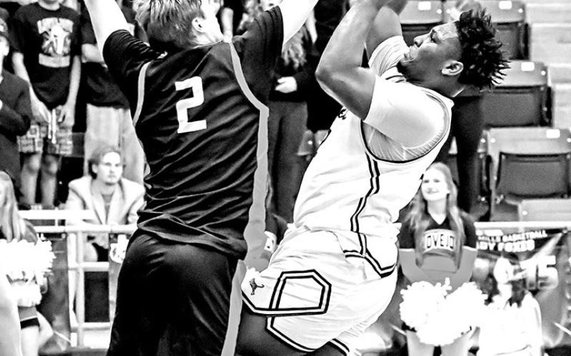 Nemo Savage shoots over a Lovejoy defender