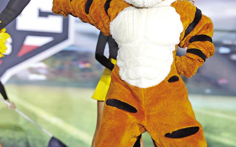 The Tiger mascot, Lakyn Fortenberry, pumps up the crowd