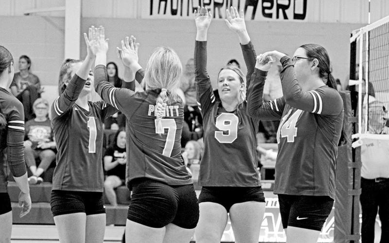 From left, Pewitt’s Avery Perry, Makenzie Bottoms, KK Jackson and Hally Taylor celebrate during a recent match. The Lady Brahmas are currently in fourth place and will play the final match of the first round of district play Friday at Redwater. TRIBUNE PHOTO / QUINTEN BOYD
