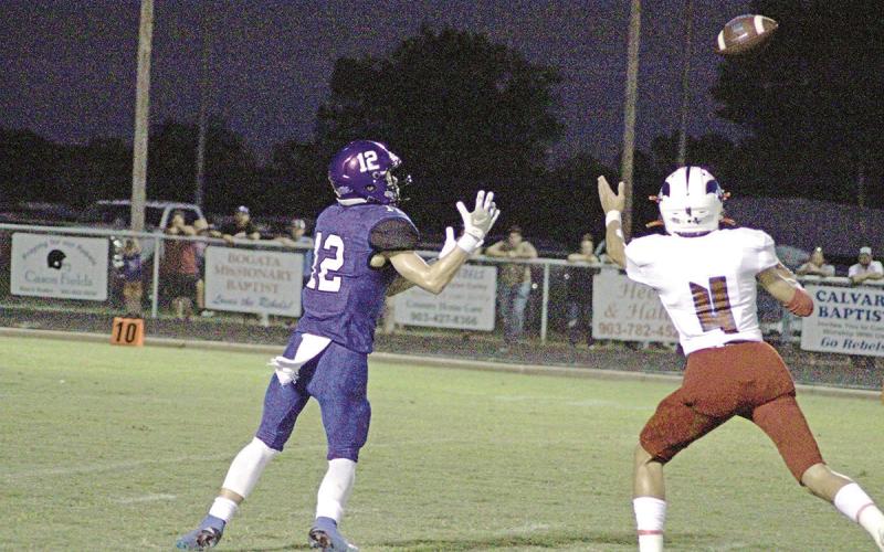 Rivercrest’s Mark Grider catches a pass during a recent game. Grider had a 62-yard touchdown reception in the Rebels’ 27-14 win at Quinlan Boles. Rivercrest takes on Wolfe City at The Swamp Friday for third place in district. TRIBUNE PHOTO / QUINTEN BOYD
