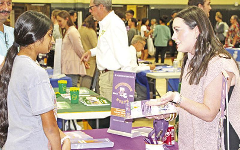 Sophomore Gopi Amin gets information about Northwestern State University