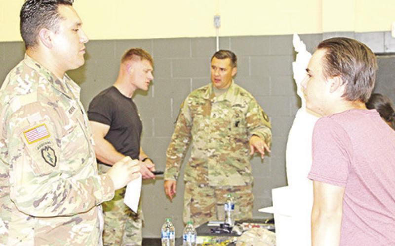 Senior Garrett McQueen listens to what the Army has to offer. COURTESY PHOTOS