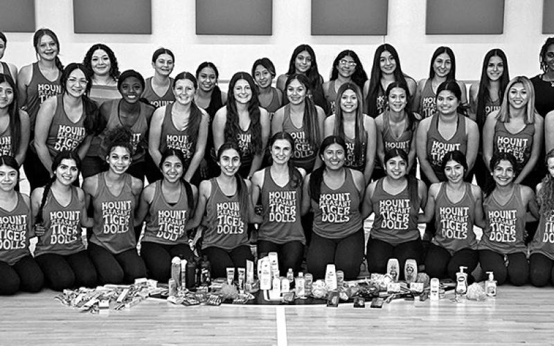 MPHS CIS Coordinators Kelsey Cameron, Juliana Flores, and the MPHS Tiger Dolls with some of the items collected. COURTESY PHOTO