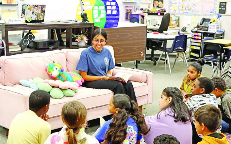 Patricia Gonzalez reads with Mrs. Ingram’s class at Fowler