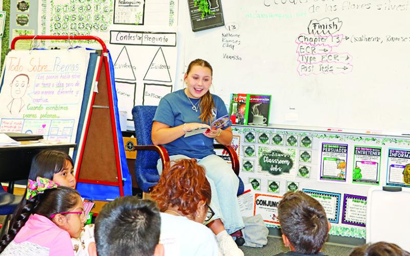 Kate Ball discusses facts about dogs with Mrs. Cates class at Sims COURTESY PHOTO
